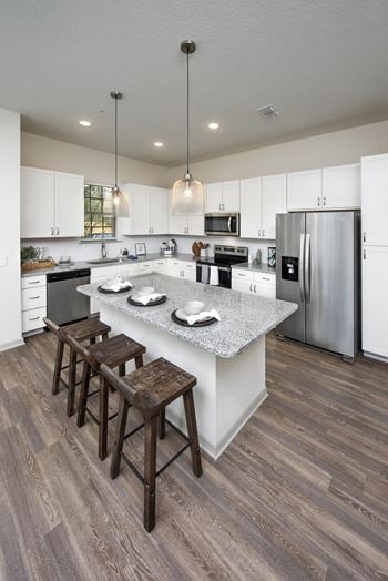 Custom white shaker cabinetry with designer hardware